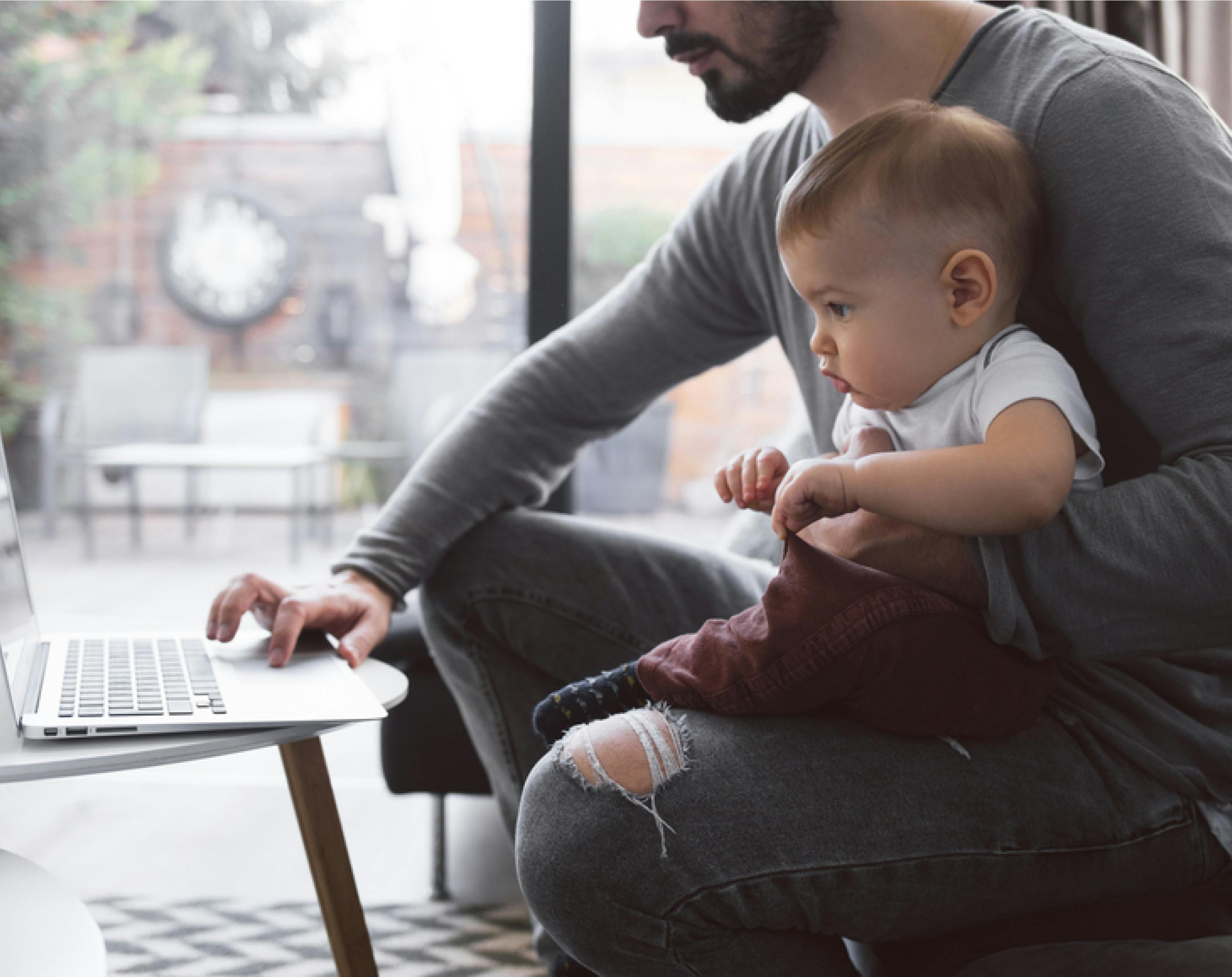 Adult and child using laptop